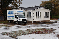 Bluebox Removals van outside a house